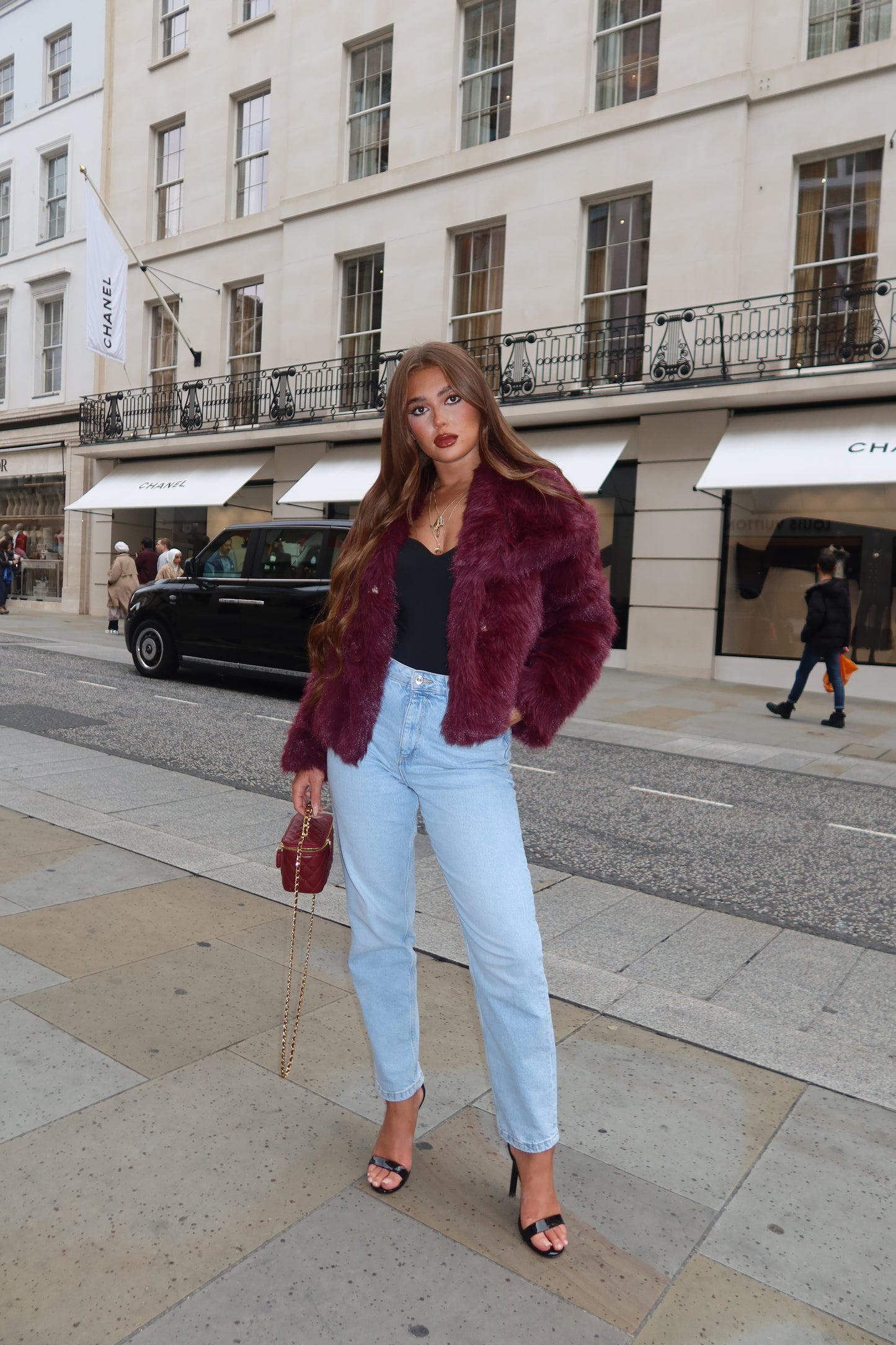 The burgundy faux fur coat