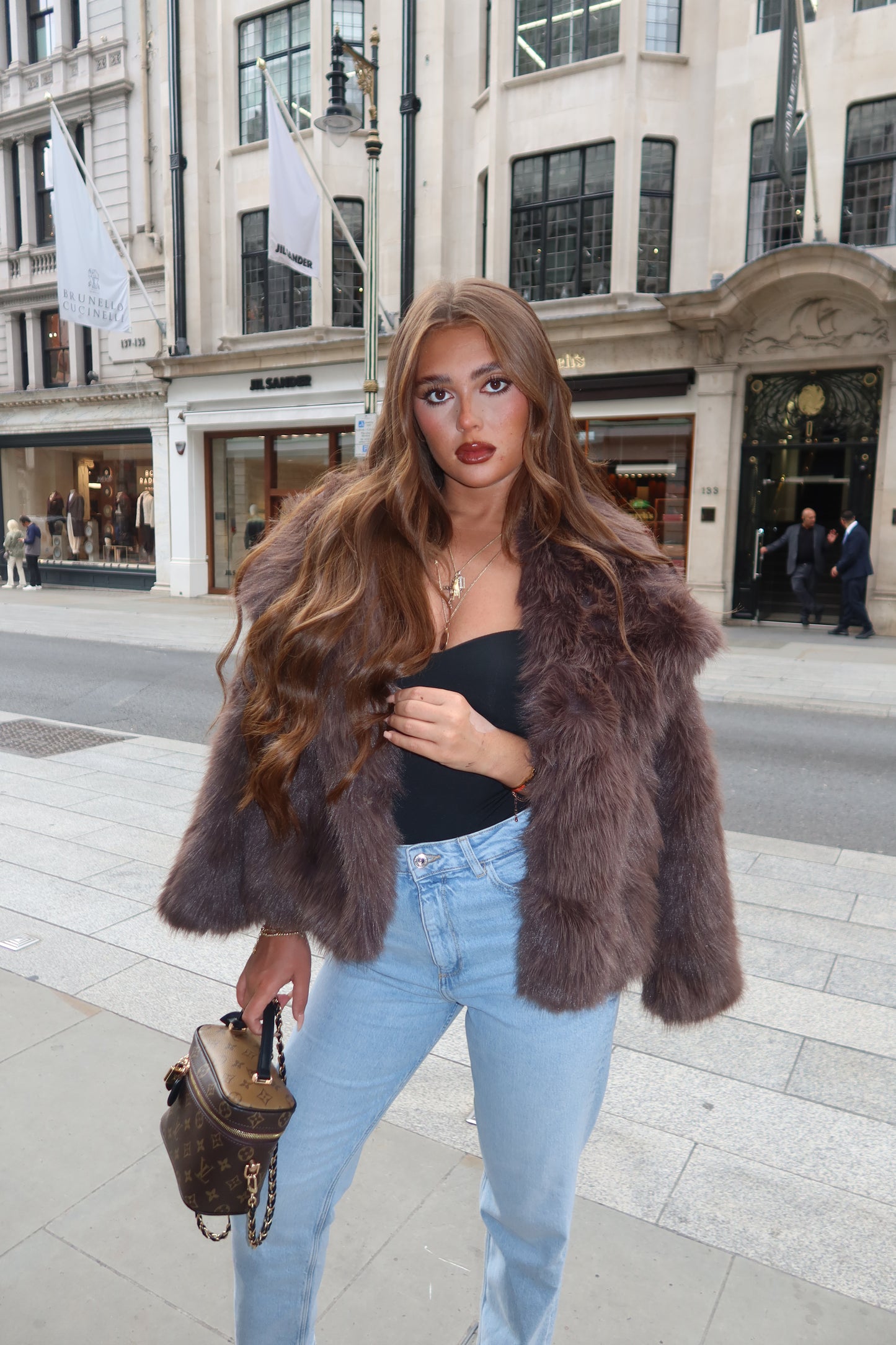 The brown faux fur coat