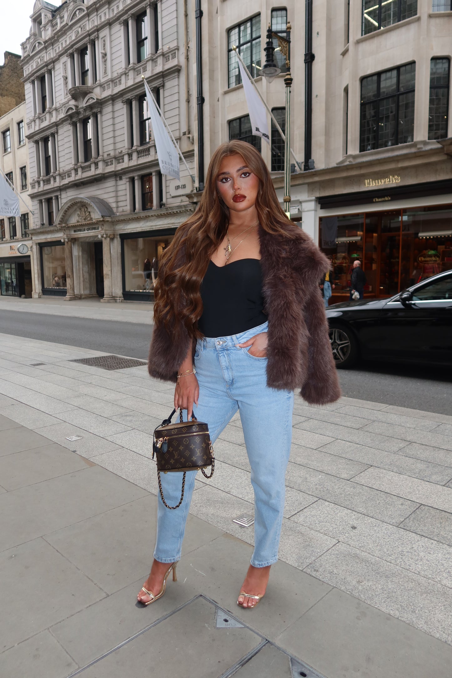 The brown faux fur coat