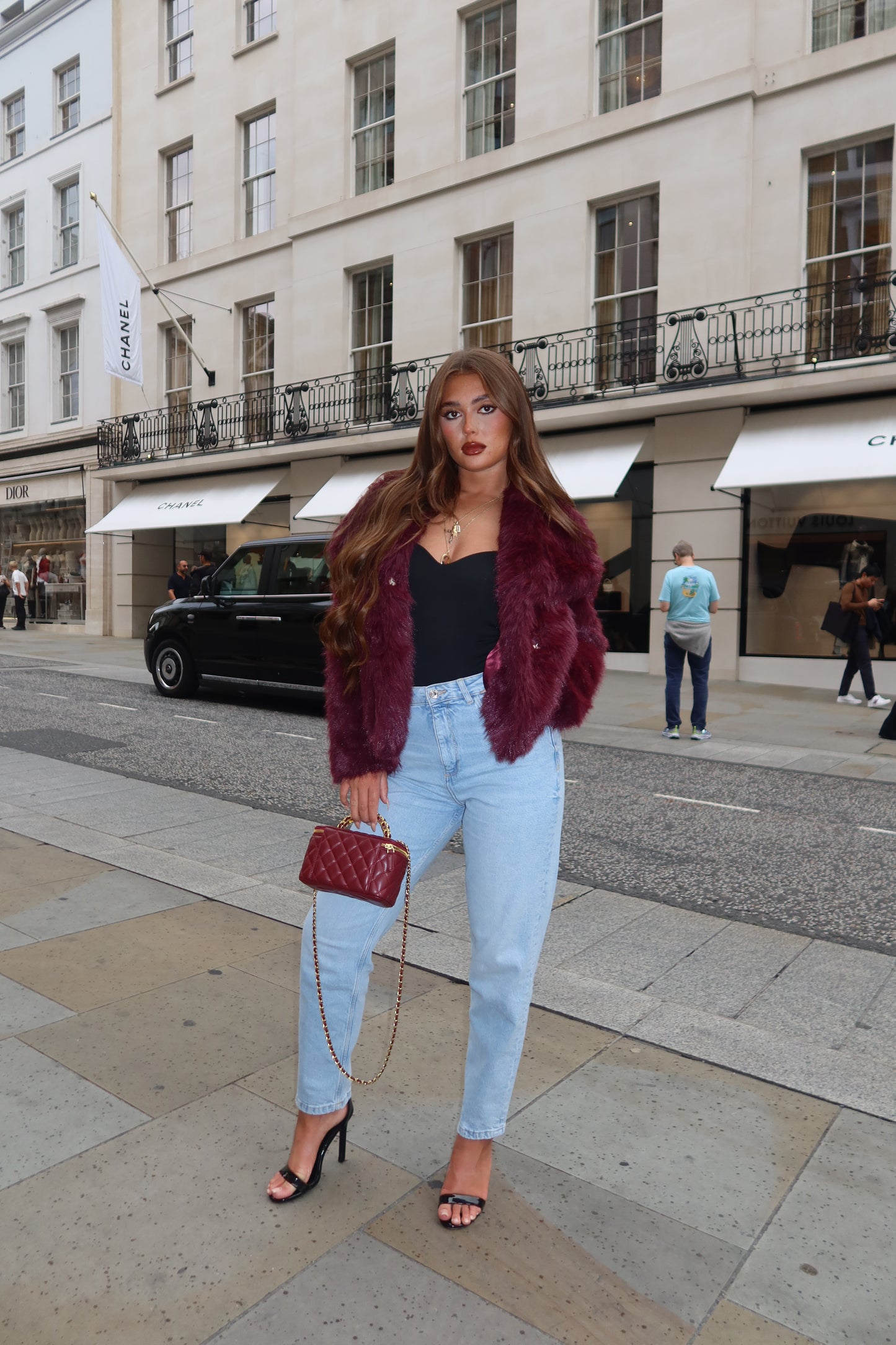 The burgundy faux fur coat