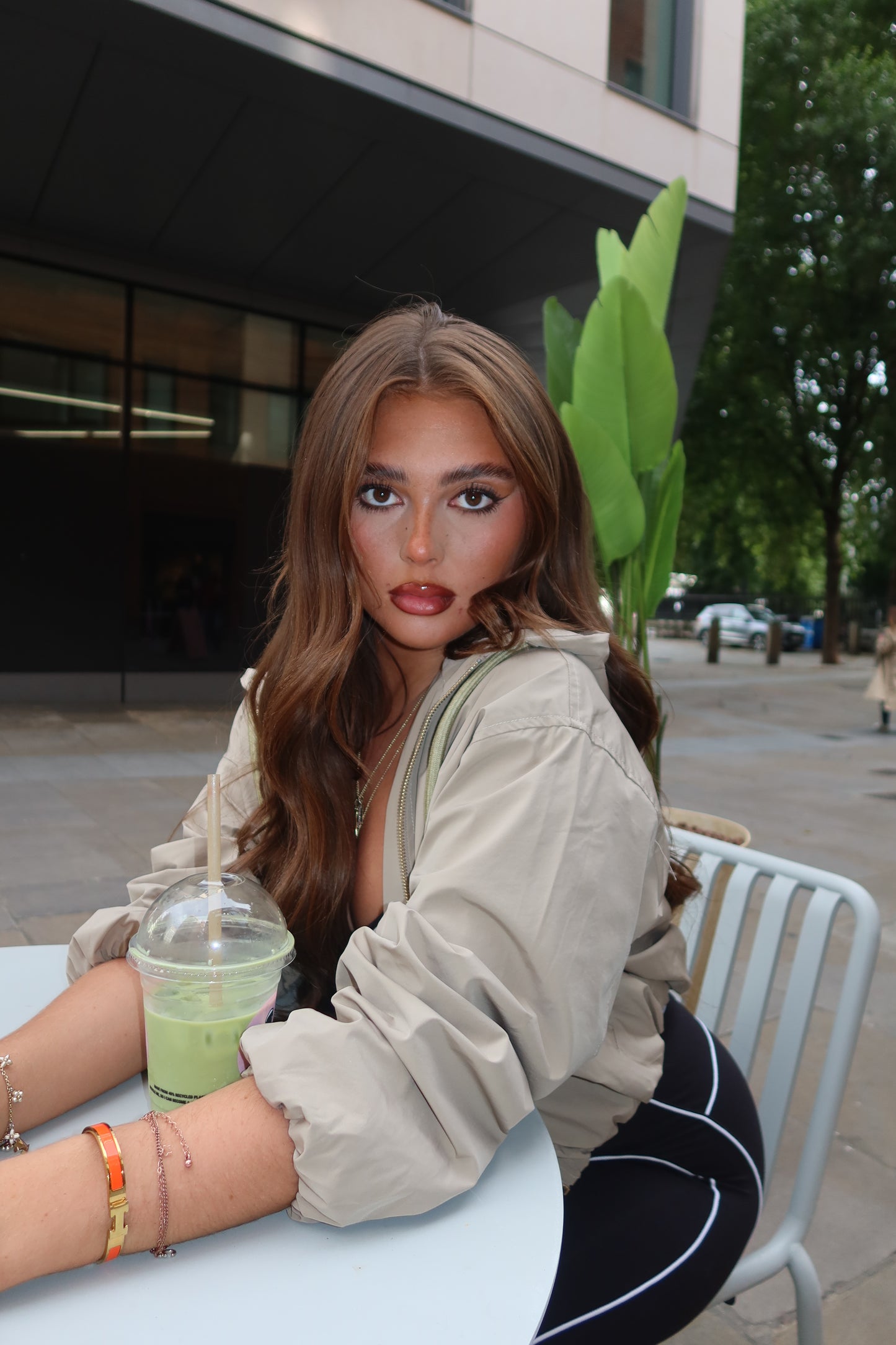 The beige cropped zip up hood jacket