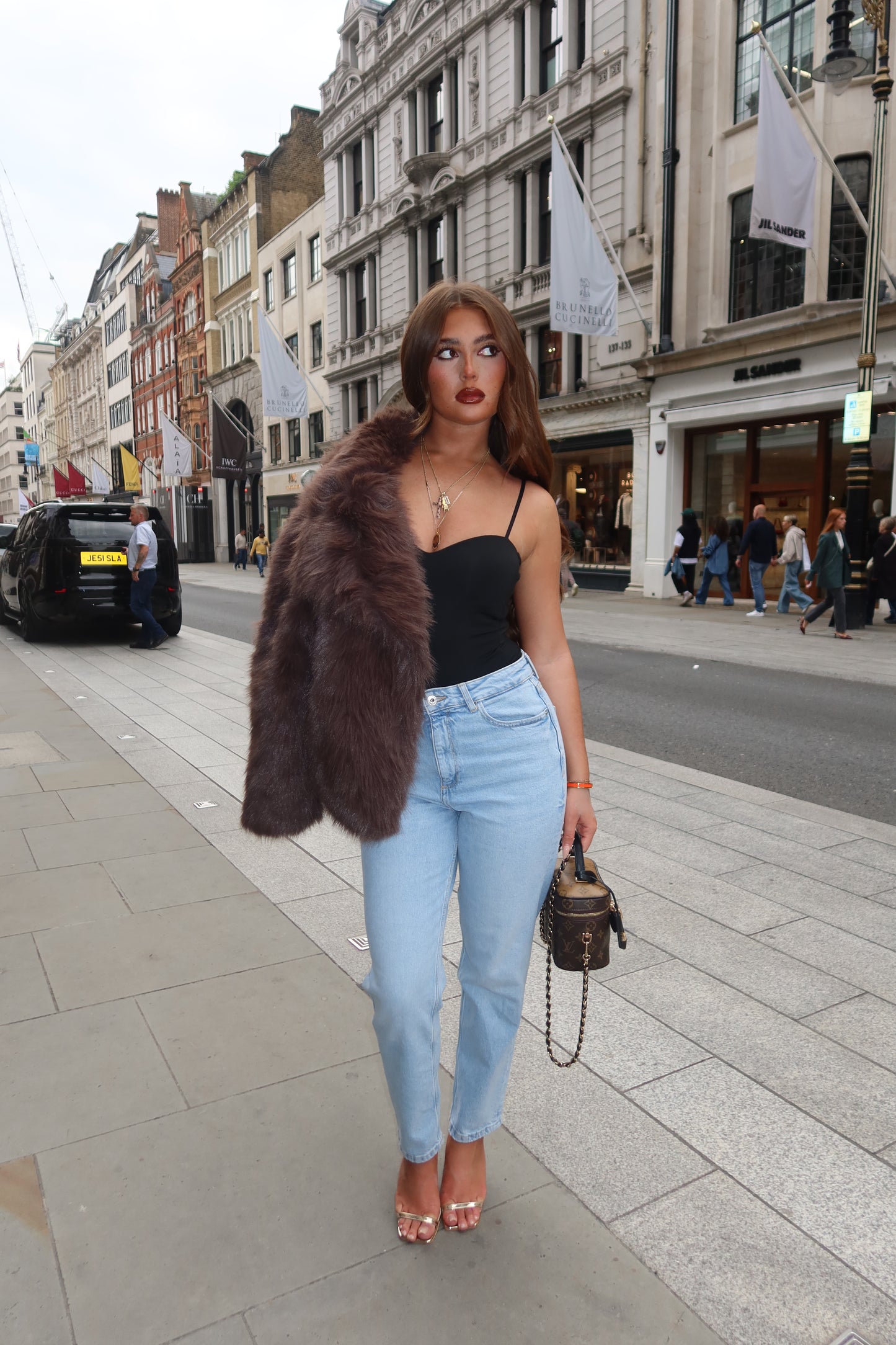 The brown faux fur coat