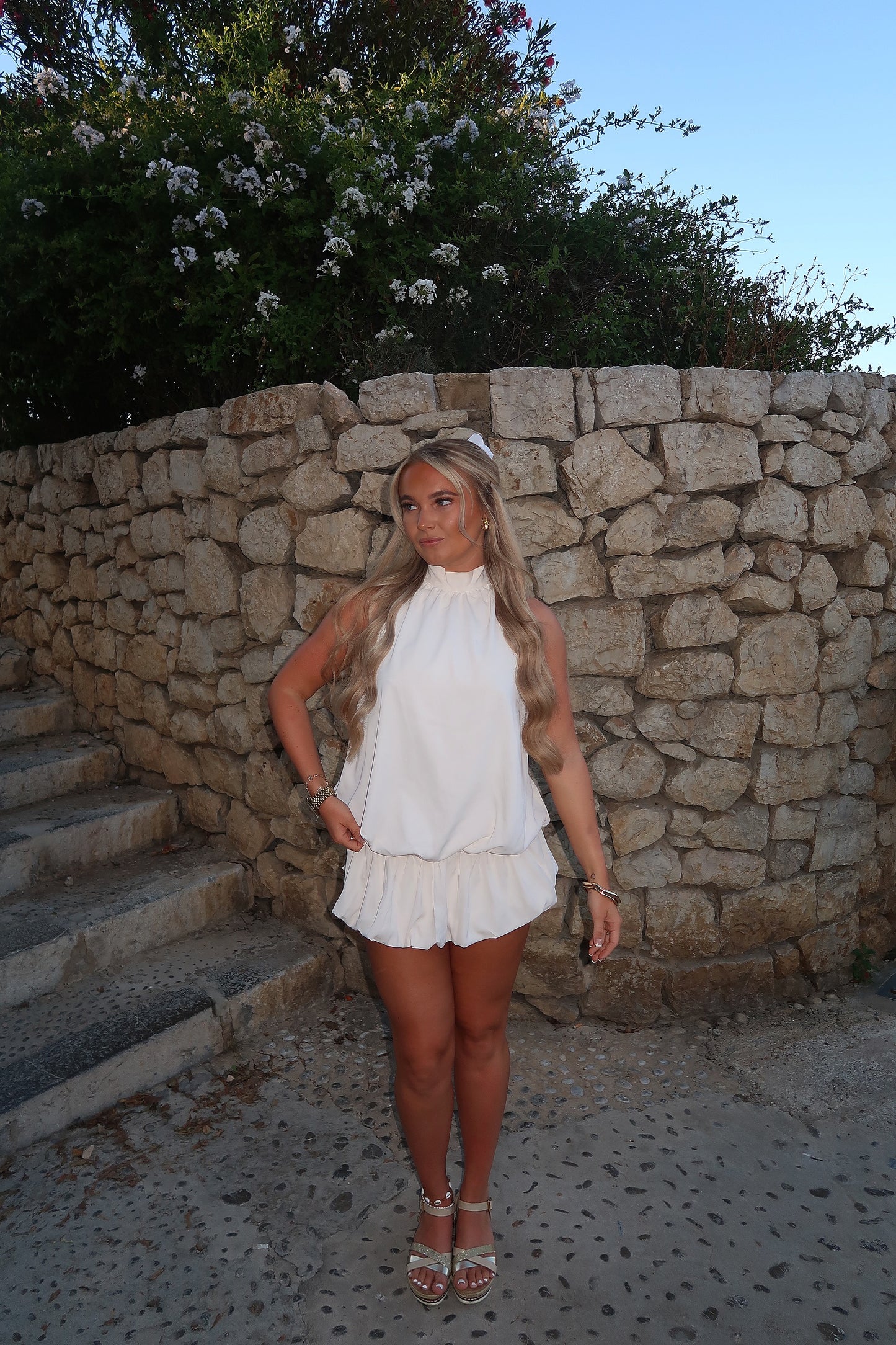 The ‘ANGEL’ white puffball playsuit beige
