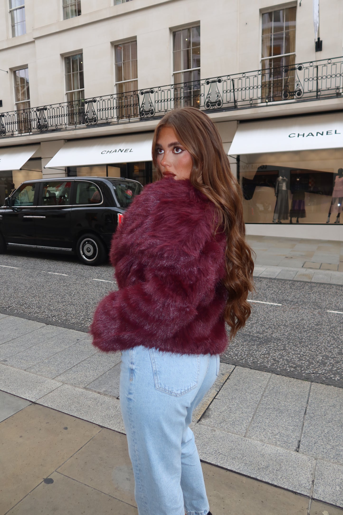 The burgundy faux fur coat