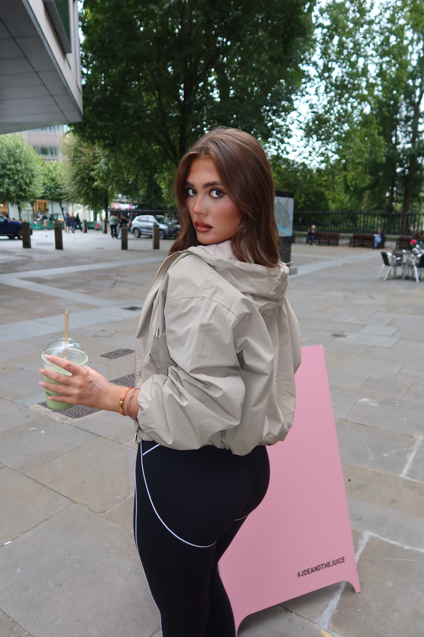 The beige cropped zip up hood jacket