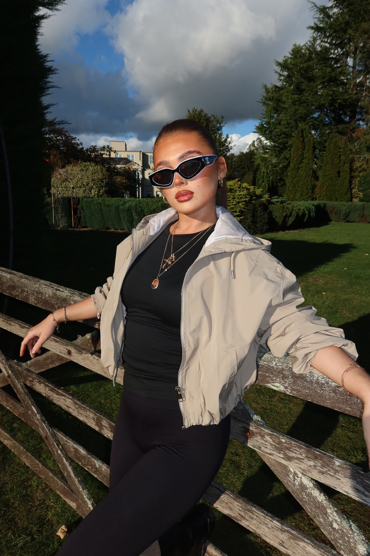 The beige cropped zip up hood jacket