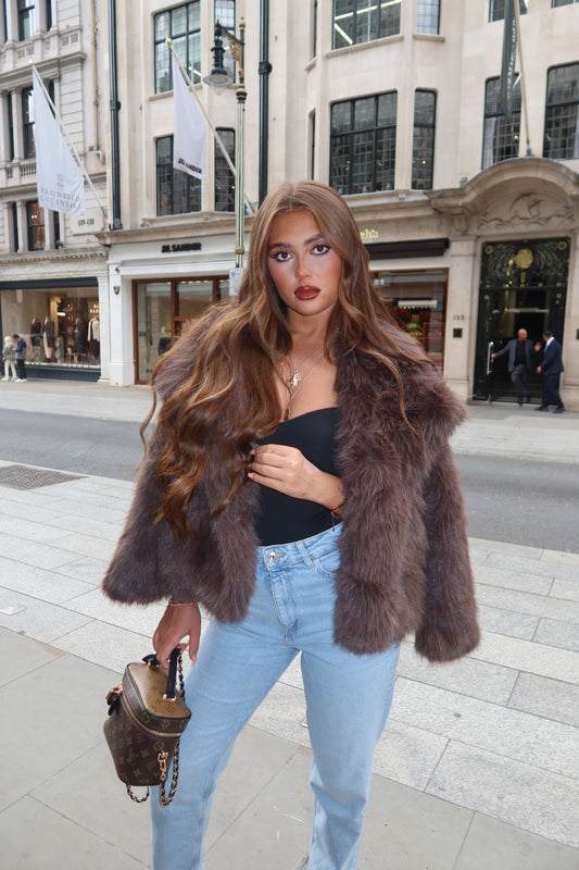 The brown faux fur coat