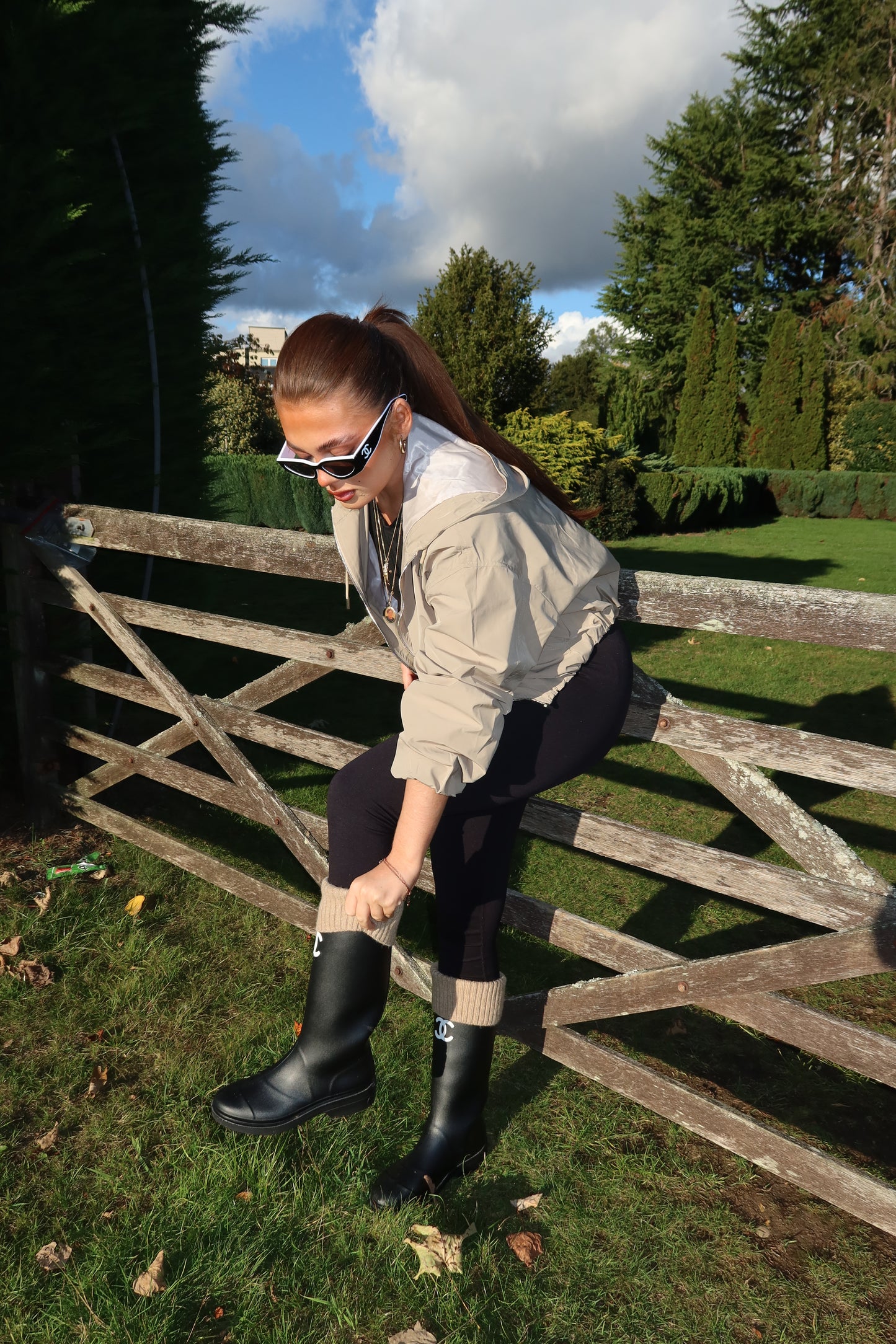 The beige cropped zip up hood jacket
